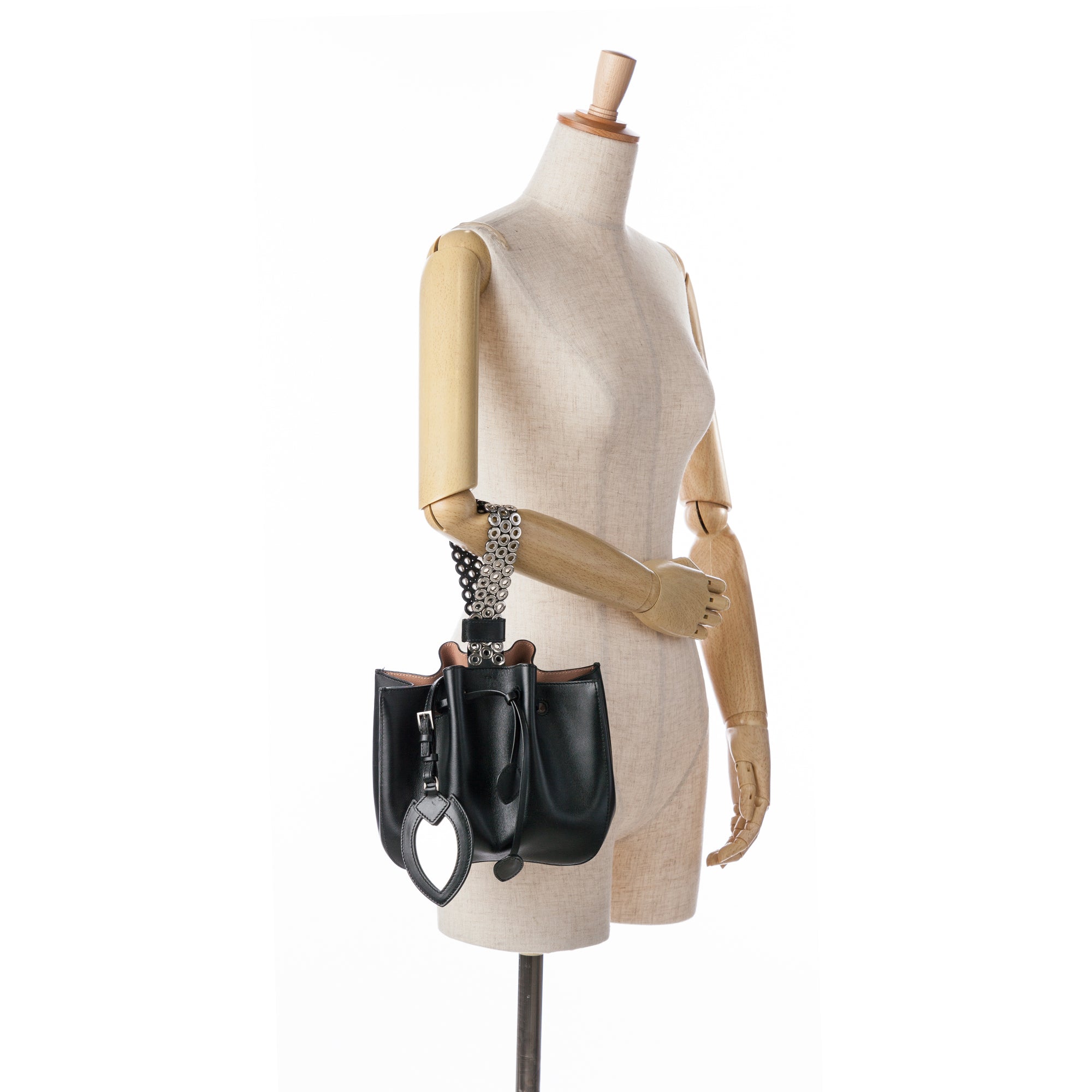 Alaïa | Pre-Owned Calfskin Eyelet Bracelet Embellished Bucket Bag | Black